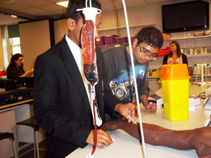 Students carry out blood transfusions