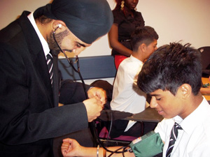 Harmeet checking blood pressure