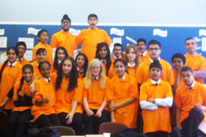 8 Orange model their t-shirts