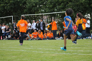 Girls relay race and crowd